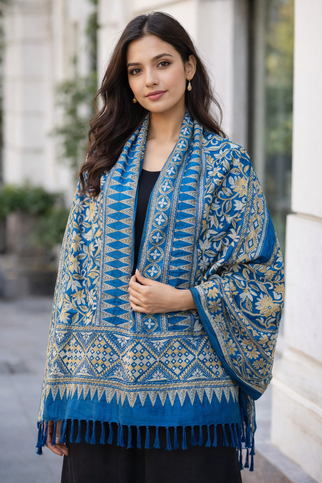 Kantha Stitch Stole - Blue & Golden 

Add a touch of elegance to your wardrobe with this stunning Royal Blue Kantha Stitch Stole, beautifully adorned with intricate gold-toned embroidery. Designed with a harmonious blend of floral and geometric patterns, this handcrafted piece reflects timeless Indian artistry and refined craftsmanship.