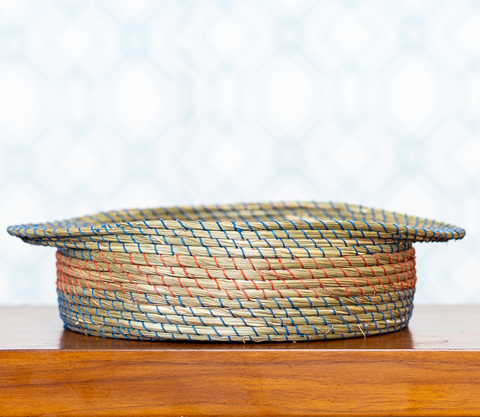 Round Basket of Sabai Grass with Blue and Red Thread Work - ArtisanSoul